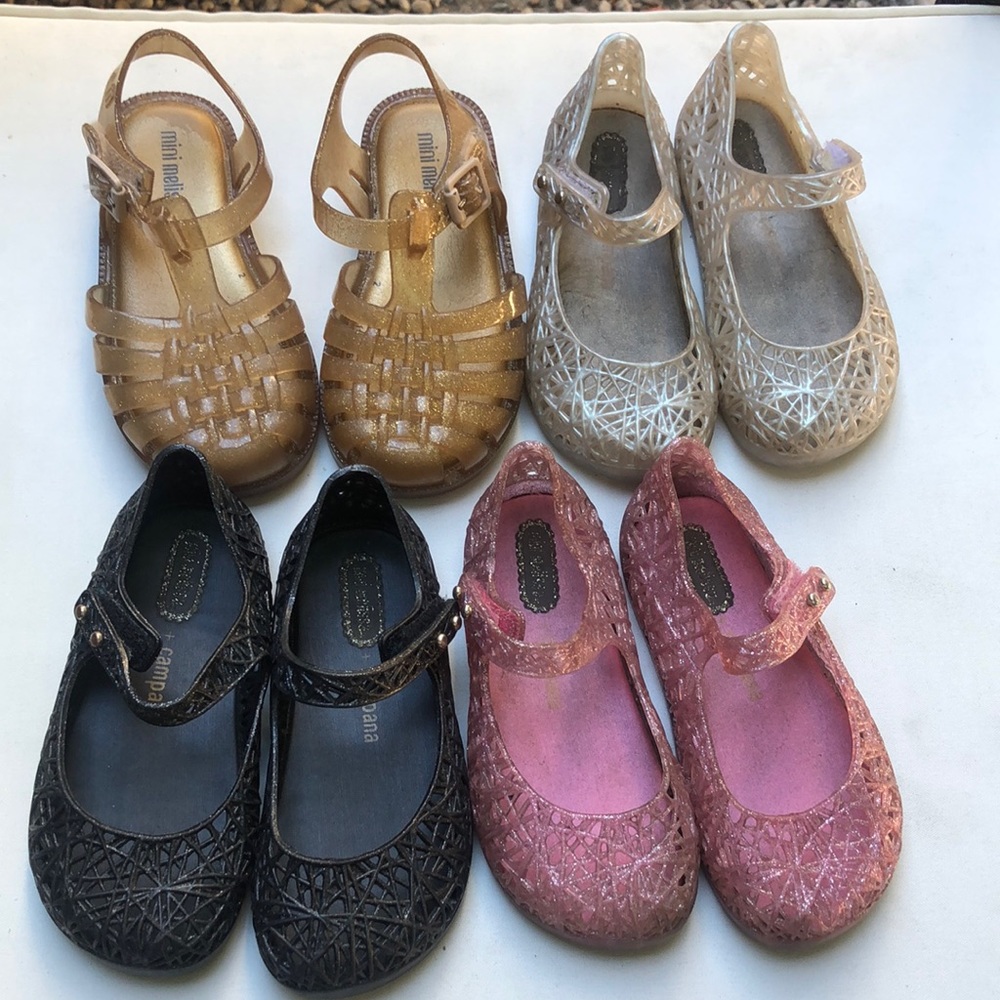 4 pairs of mini Melissa’s toddler shoes.